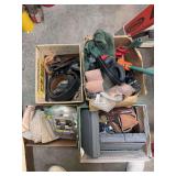 Four boxes of miscellaneous gun and shooting related items, including holsters, shooting rest, police belt