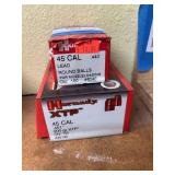 Two boxes of 45 caliber bullets and lead balls