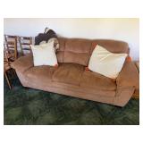 Tan upholstered full-size sofa