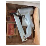 Senco Pneumatic stapler with four boxes staples