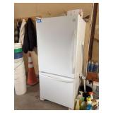 Kenmore refrigerator freezer in garage. See photos for model