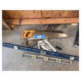 Assortment of saws, levels, squares