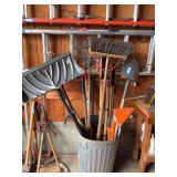 Trash can full yard tools