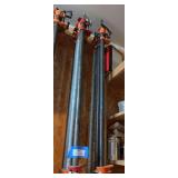 Eight large pipe clamps