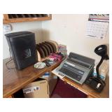 Electric typewriter, desk lamp, paper shredder, file organizer