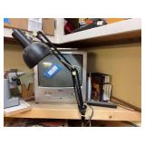 Haier small television with built-in DVD player, desk light, and some woodworking DVDs