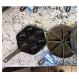 Two cast-iron pans cornbread and ableskiver (extra cast-iron lid size removed from lot)
