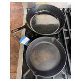 Large antique cast-iron skillet and medium sized cast-iron skillet