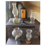 Three oil lamps plus candle and additional hurricane