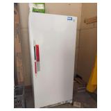 Kenmore upright freezer in garage. See photos for model