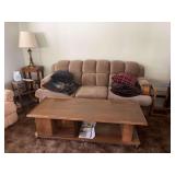 Full living room set up includes vintage sofa, coffee table, 2 matching oak end tables with glass shelves and additional wood table with brass lamp
