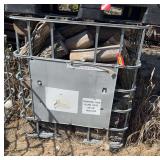 Metal water carrier crate with firewood