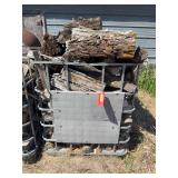 Metal water carrier crate with firewood