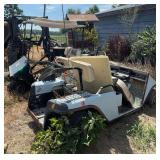 2 Ez-go golf carts and parts mower (buried in trees)