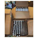Two boxes clear glass votive holders 36/box and approx 100 1oz amber glass bottles w lids