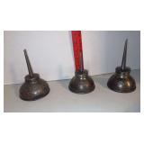 Three Ford oil cans