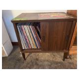 Record cabinet w unsorted records and cassette holder w cassettes