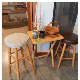 Tv tray, two stools, two pottery mugs and pair of candle holders with candles and collapsible basket