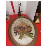 Curved glass frame w dried floral arrangement and candle holder