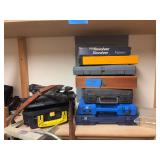Empty handgun cases and tripod, and leather gun sling