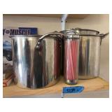 Three stock pots and straw dispenser