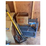 Light duty metal shelving unit, hand tools, including pitchfork, and American rifleman magazines
