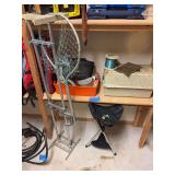 Assortment of fishing items includes tackle boxes, reel holder, small stool, lifejackets, etc.
