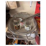 Pair of grill baskets and tongs and three whiskey glasses plus large serving spoons