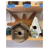 Two bird houses and wood slab