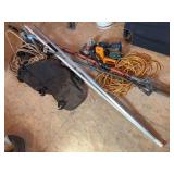 Rope, pole saw, extension cord, assortment of tools