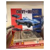 Vintage Chevrolet metal sign and two books