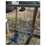 Shovel, manure fork, and tomato cages