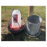 Heated poultry waterer, rubber feed pans, and galvanized feeder