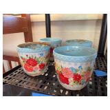 Four small pioneer woman planters
