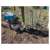 Variety of plastic pots and garden decor