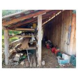 Lean to storage rack items, including lumber, PVC pipe, tire chain, some gas cans, hoses, small generator, sway bar, etc. - take what is useful to you