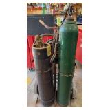Oxy acetylene torch set on cart with lots and lots of hose