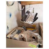 Milk crate full of paint roller handles and a box full of paint roller pads many many
