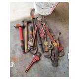 Hammers, and many pipe wrenches also a crescent tools antique nail puller