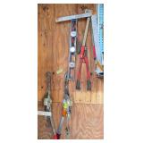 Two cable come alongs, 2 ft level, two sets of bolt cutters, framing square and some kind of specialty tool
