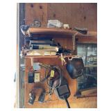 Large selection of welding rods, two welding helmets, chipping hammers, welding gloves, and other various supplies