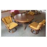48' round table and 4 chairs split bamboo, one chair pad is torn.