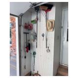 Brooms, dust pans- all hanging on wall
