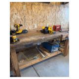 Heavy Duty work bench with red vice, 74x34, loose wood includes long trim boards on floor, racks, bring help to move (No other contents on top included)