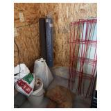 Chains in bag and crate, wood chips, red garden fence?