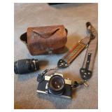 Camera with case and extra lens