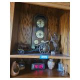 Vintage decorative model cannon featuring a dark metal carriage with spoked wooden wheels and a polished brass barrel, Clock, Pottery, Horse Wood Sculpture,  Donkey Barometer Clock (2 Shelves) - Bring