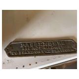 Brass sign, possibly from a railroad car?