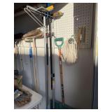 Brooms and mops-All hanging on wall