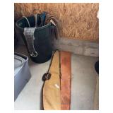 Trash can, halters and ropes, gun cases, cinch